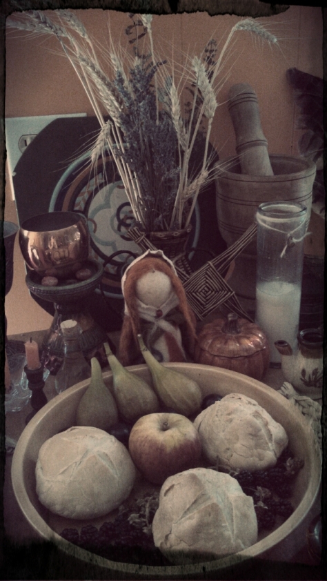 Needle-felted Brigh doll and offerings to the Spirits from our land: plums, figs, apples, and homemade sourdough. 